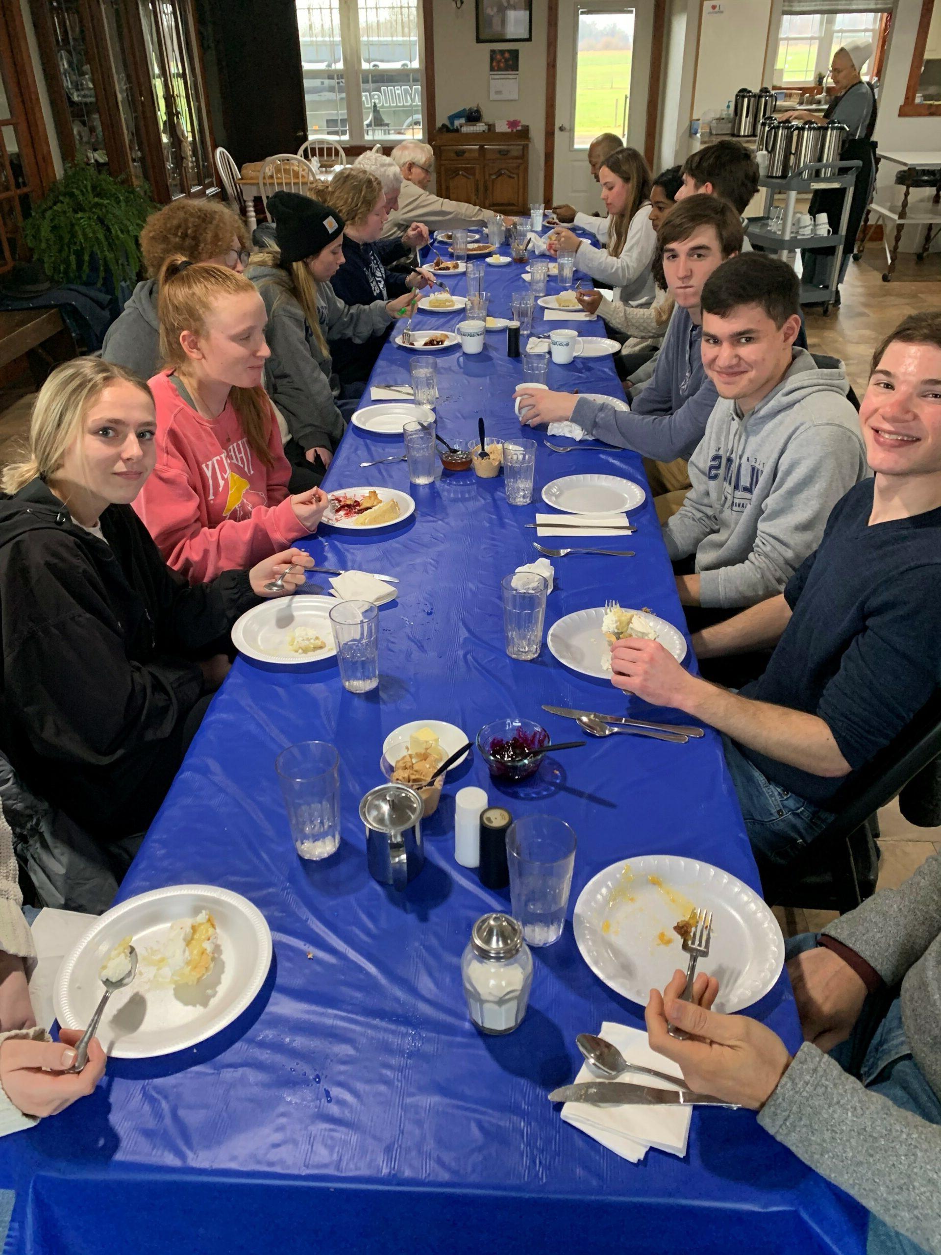 Students seated at dinner table